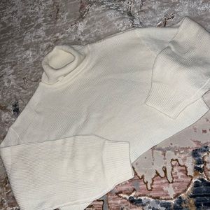 Cropped oversized turtleneck